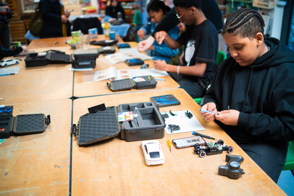 Image of children fixing with Team Repair kits